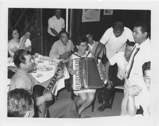 Mrs. Colaruotolo playing the accordion with friends and family, Casa Larga Vineyards