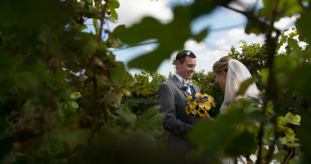 Couple in vineyards, Wedding Receptions and Ceremonies at Casa Larga Vineyards