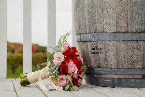 Bouquet of Flowers and Casa Larga Wine Barrel on Patio, Weddings at Casa Larga Vineyards