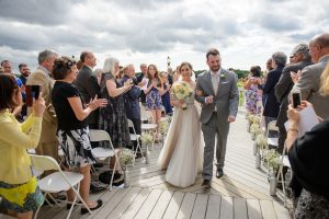 Husband and wife walking down aisle, Wedding Ceremonies and Receptions at Casa Larga Vineyards