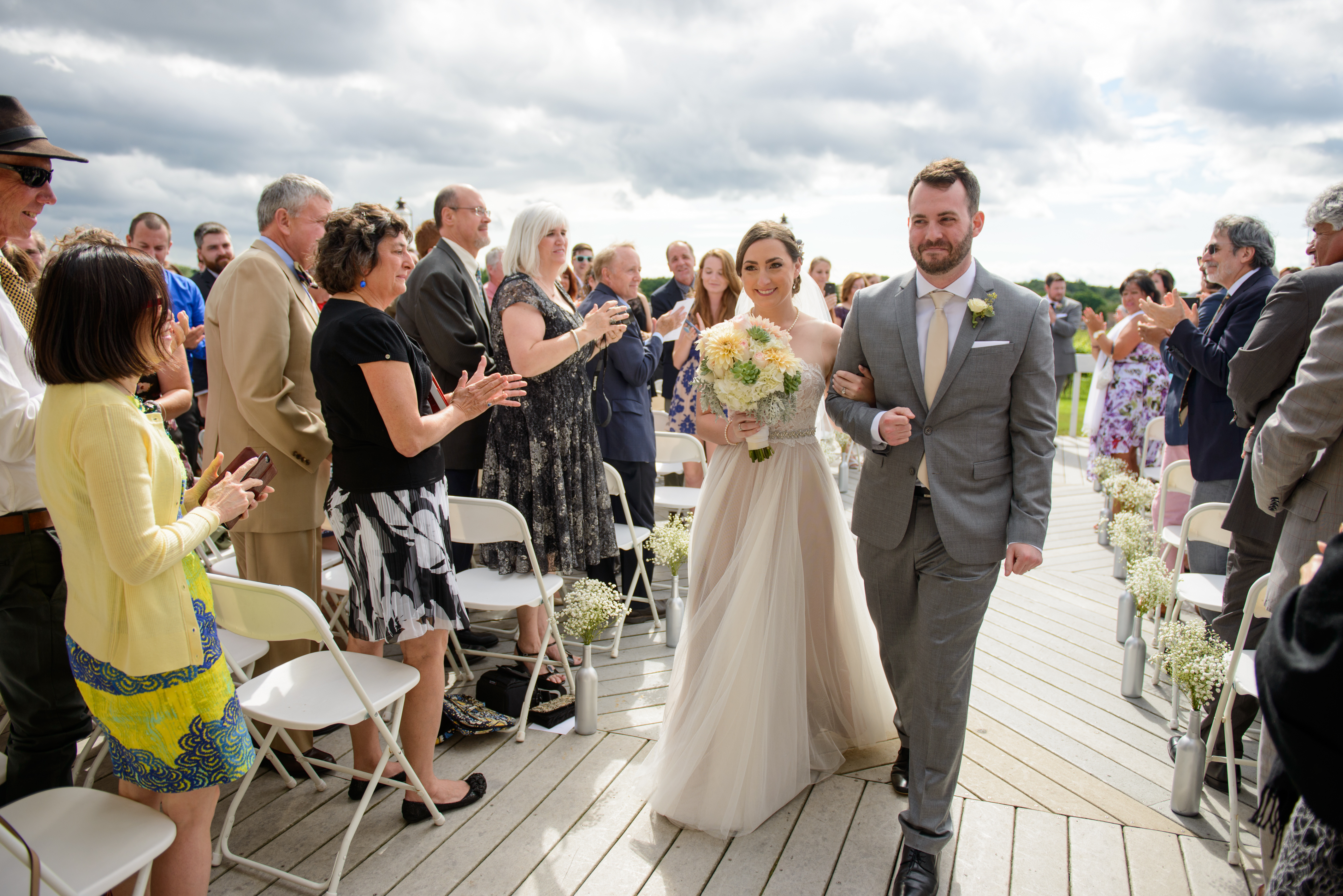 Husband and wife walking down aisle, Wedding Ceremonies and Receptions at Casa Larga Vineyards