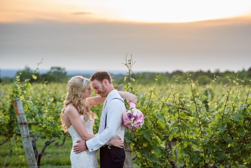 Couple in the vineyards, Wedding Ceremonies and Receptions at Casa Larga Vineyards