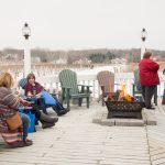 Customers enjoying ice wine on the deck at Ice Wine and Culinary Festival at Casa Larga Vineyards