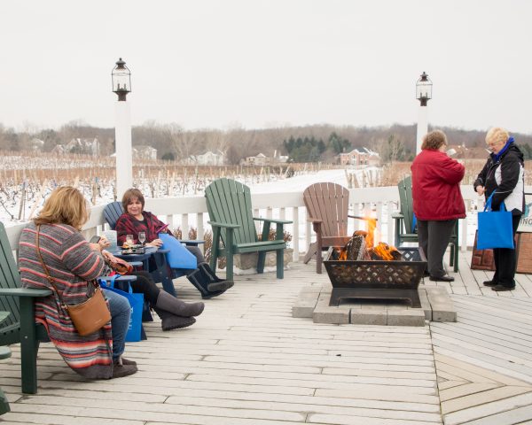 Customers enjoying ice wine on the deck at Ice Wine and Culinary Festival at Casa Larga Vineyards